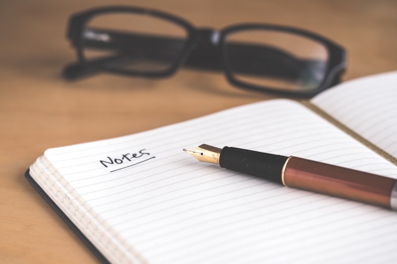 Fountain pen and notebook representing personal statement writing