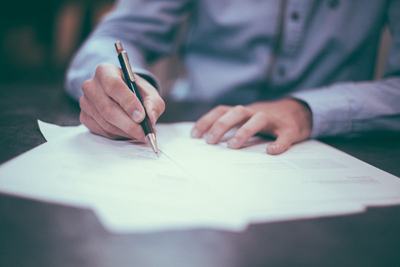 Person signing a formal affidavit document